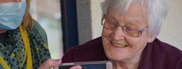 Older woman looking at phone 