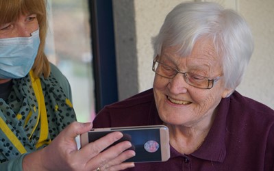 Older woman looking at phone