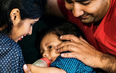 Family feeding child