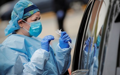 Healthcare professional taking swab