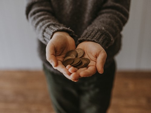 hands holding loose change