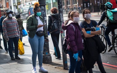 people wearing face masks in London street